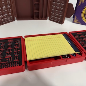 Legal pad fits in the cutouts of the tracker