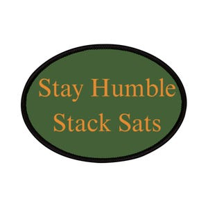 May include: An oval patch with the text "Stay Humble Stack Sats" in orange letters on a green background. The patch has a black border.
