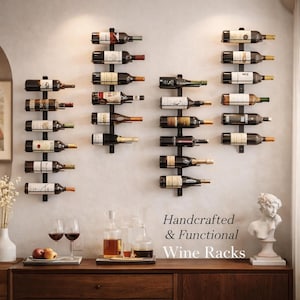 May include: A display of wine bottles on black metal wall-mounted racks. The racks are arranged in rows, holding various bottles. The image includes the text "Handcrafted & Functional Wine Racks". A wooden cabinet and wine glasses are in the foreground.