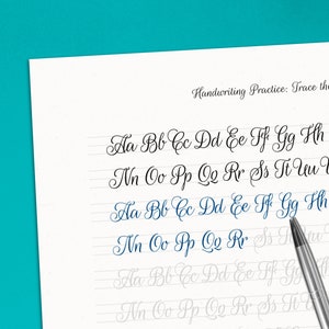 May include: Handwriting practice worksheet with cursive alphabet letters to trace. The letters are printed in black ink on white paper with blue lines. The letters are in lowercase and include Aa Bb Cc Dd Ee Ff Gg Hh Ii Jj Kk Ll Mm Nn Oo Pp Qq Rr Ss Tt Uu Vv Ww Xx Yy Zz.