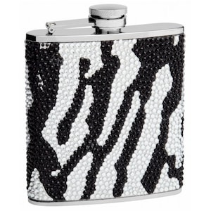 May include: A silver flask with a black and white zebra print design. The flask is made of stainless steel and has a screw-on cap.