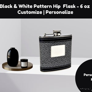 May include: A black and white patterned hip flask with a silver lid and a silver rectangular plate for personalization. The flask is 6 ounces and is sitting on a white surface. The text "Personalize Me" is on a black circle with white stars.