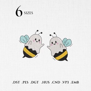 May include: An embroidery design featuring two cartoon bees wearing ghost costumes with light blue wings, yellow and black striped bodies, and pink cheeks. The text 6 SIZES is at the top, and file formats .DST .PES .DGT .HUS .CND .VP3 .EMB are at the bottom.
