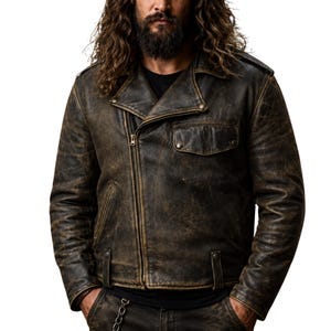 May include: A distressed brown leather motorcycle jacket with a diagonal zipper closure, a small pocket on the chest, and a notched collar. The jacket has a worn, vintage appearance.