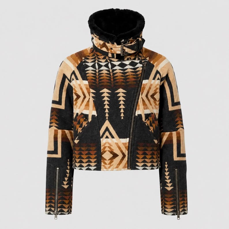 May include: A cropped jacket featuring a geometric pattern in shades of black, tan, and brown. The jacket has a high collar lined with black faux fur, an asymmetrical front zipper closure, a buckled neck strap, and zippered cuffs on long sleeves.