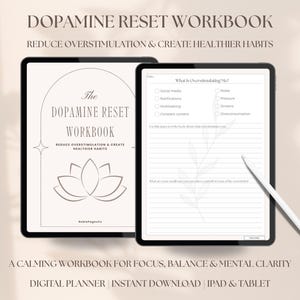 May include: Two digital tablets displaying a workbook titled "Dopamine Reset Workbook." The text reads "Reduce Overstimulation & Create Healthier Habits." One tablet shows the cover with a lotus flower design. The other shows a worksheet with prompts. A stylus rests on the second tablet.