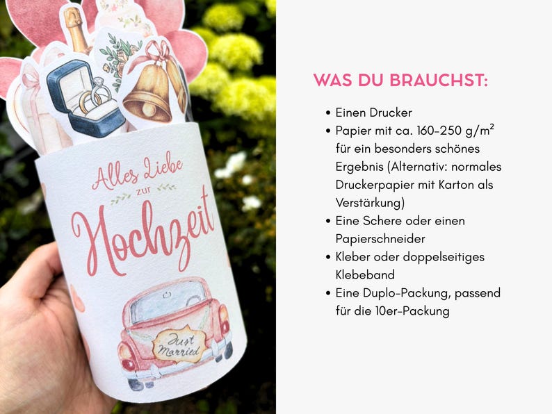 May include: A cylindrical paper wrapper featuring the German text Alles Liebe zur Hochzeit and a pink car with a Just Married sign. The top displays watercolor illustrations of wedding rings in a blue box, gold bells, and pink hearts.
