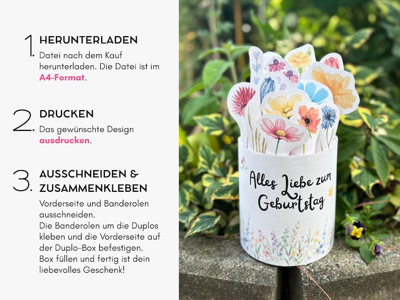 Puede incluir: Una caja de regalo cil&iacute;ndrica blanca con el texto en alem&aacute;n 'Alles Liebe zum Geburtstag' y un colorido arreglo floral de acuarela en la parte superior. El lado izquierdo muestra instrucciones en alem&aacute;n: 1. HERUNTERLADEN, 2. DRUCKEN, 3. AUSSCHNEIDEN & ZUSAMMENKLEBEN.