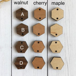May include: Four hexagonal wooden shapes in walnut, cherry, and maple wood. Each shape is labeled with a letter from A to D. The wood shapes are arranged in three columns labeled walnut, cherry, and maple.