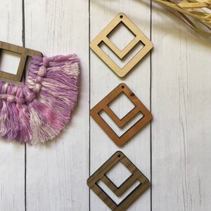 May include: Three wooden diamond-shaped earring blanks with a chevron cutout. The blanks are in natural wood, brown wood, and dark wood.