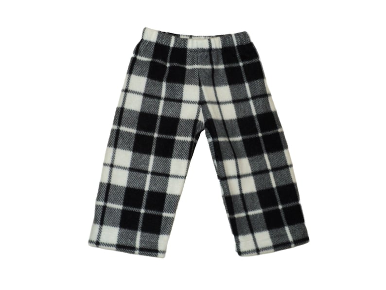 Black and white plaid pants with legs apart. Straight legs that are hemmed at the bottom. Narrow black and white lines separating black, gray and white squares. Elastic waistband.