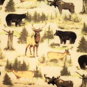 May include: A fabric pattern with a repeating design of woodland animals, including deer, bears, and moose, set against a backdrop of trees and a light-coloured background. The animals are depicted in shades of brown, black, and tan.