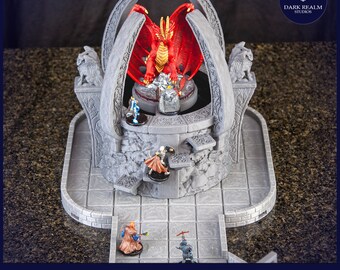 May include: A 3D printed dungeon terrain set featuring a red dragon statue on a stone platform. The platform is surrounded by a stone wall with a gate. The set includes a variety of other stone structures and figures, including a well, a tower, and a bridge. The set is designed for use in tabletop role-playing games.