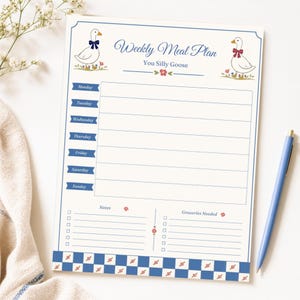 May include: A weekly meal plan notepad with a whimsical design. The notepad features a cream-colored background with blue accents and illustrations of geese. The text "Weekly Meal Plan" and "You Silly Goose" are displayed at the top.