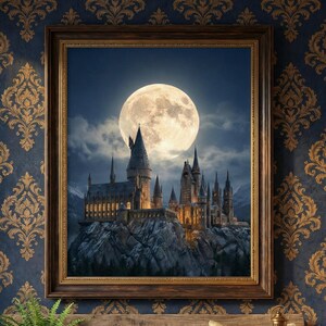 May include: A framed print of a castle under a full moon, with a wooden bench, pillows, and a lantern in front. The castle is lit up, set against a night sky. The frame is brown, and the wallpaper is blue with a gold pattern.