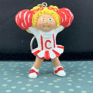 Vintage 1984 Cabbage Patch Kid White and Red Cheerleader Figure Keychain - Carry Some 80s Childhood Nostalgia in Your Pocket!