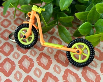 Vintage Neon Kick Scooter Keychain – Retro Orange & Yellow Plastic Charm