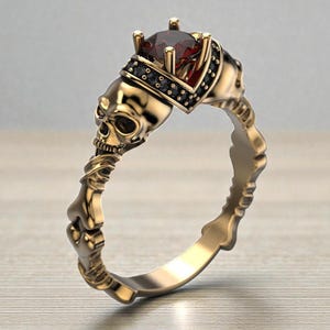 Op de afbeelding: Een witte keramische mok met een zwart handvat en de tekst "But First, Coffee" in een zwarte, handgeschreven lettertype. De mok staat op een wit oppervlak.