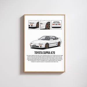 May include: Framed print of a white Toyota Supra A70. The print includes three smaller illustrations of the car and the text "TOYOTA SUPRA A70". The car has bronze-coloured wheels and a sleek design.