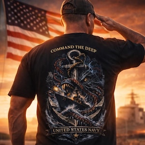 May include: Black t-shirt with a detailed graphic featuring an anchor, an octopus, and a warship, with the text "COMMAND THE DEEP" and "UNITED STATES NAVY". The image also includes the text "SALUTE THE TROOPS".