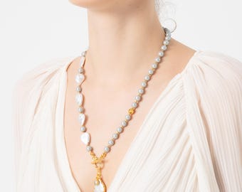 Collier réfléchissant à pendentif perle