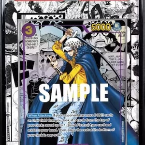 May include: A graded trading card featuring Trafalgar Law from One Piece. The card has a colorful illustration of the character with text that reads "SAMPLE". The card is graded GEM MT 10 and is from the OP05-MANGA ALT ART set.
