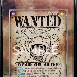 May include: A graded trading card featuring Monkey D. Luffy from One Piece. The card displays a "Wanted" poster design with Japanese text and a character illustration. The card is graded 10 and is in a protective case.