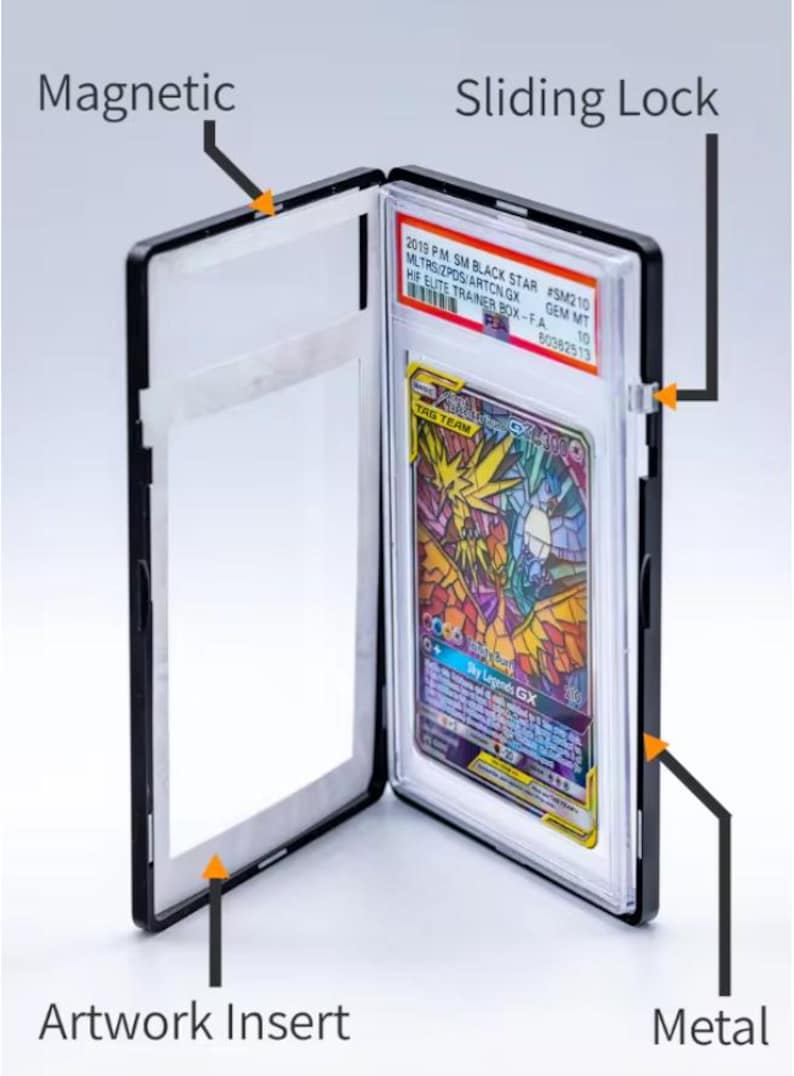 May include: Black card holder with a magnetic closure and sliding lock. The holder contains a colorful trading card with the text "TAG TEAM GX". The holder also has an artwork insert and metal components.