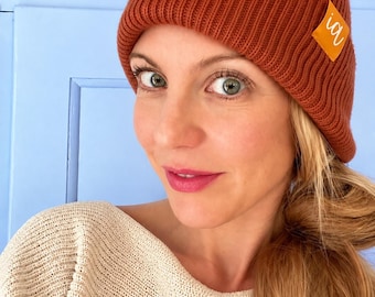 Deep Cuffed Beanie – ribbed winter hat made from recycled polyester with a yellow “IA” label