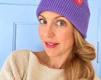 Deep Cuffed Beanie – ribbed winter hat made from recycled polyester with a coral-colored "IA" label
