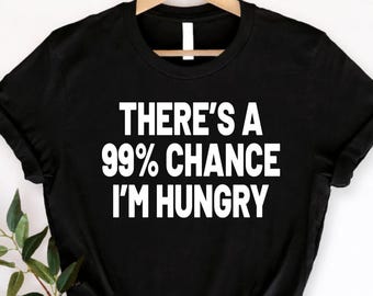 Camiseta con la frase "Hay un 99% de probabilidades de que tenga hambre", camiseta divertida sobre comida, camiseta con cita sarcástica, ropa con eslogan humorístico, idea de regalo de cumpleaños.