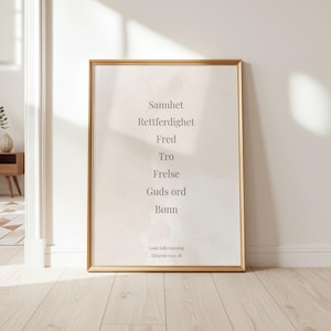 May include: A framed wall art print featuring a light beige watercolor background with dark gray text listing the words Sannhet, Rettferdighet, Fred, Tro, Frelse, Guds ord, and Bønn, followed by the smaller text Guds fulle rustning Efeserne 6:10-18.
