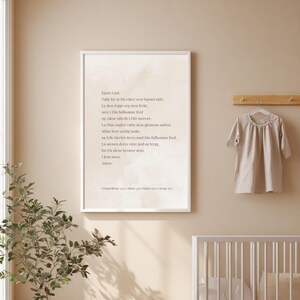 May include: A rectangular wall art print in a white frame featuring Norwegian text on a light beige watercolor background. The text reads: Kjære Gud, Takk for at Du våker over barnet mitt, La dem legge seg uten frykt, sove i Din fullkomne fred.