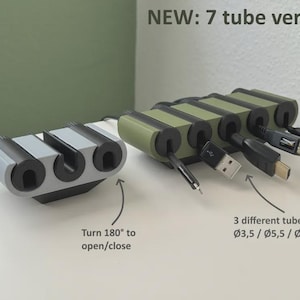 May include: Cable organizer in gray and olive green. The organizer has a 7-tube version and a 3-tube version. The text says "Turn 180° to open/close" and "3 different tube sizes: Ø3.5 / Ø5.5 / Ø7.5mm". Cables are inserted into the tubes.