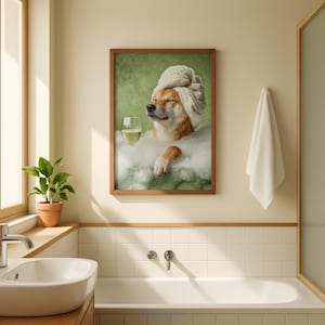 May include: A framed print depicts a Shiba Inu dog relaxing in a bubble bath, wearing a towel on its head and holding a glass of white wine. The dog is surrounded by bubbles, with a green background. The image is in a bathroom setting.