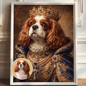 May include: A framed portrait of a Cavalier King Charles Spaniel wearing a gold crown with blue gems and a blue velvet robe with gold embroidery and pearl necklaces. A small circular inset shows the original dog photo with a tan background.