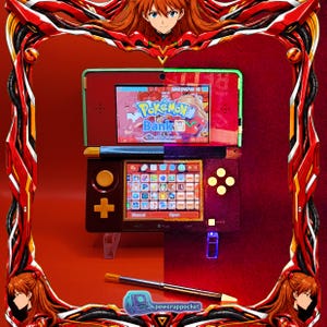May include: A handheld gaming console featuring a dual-screen design with a red and black color scheme. The top screen displays the Pokémon Bank logo, while the bottom touchscreen shows a grid of application icons. A stylus rests below the console.