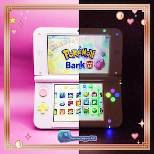 May include: A split image of a white and gray Nintendo 3DS handheld game console. The screens display the "Pokémon Bank" logo and various game icons. The console has a pink and yellow button layout. The image includes the text "poweruppocket".