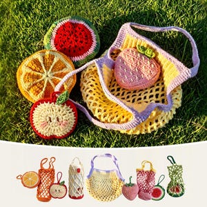 May include: A collection of colorful, crocheted fruit-themed items. Includes a watermelon slice, orange slice, apple, and a strawberry-shaped bag inside a yellow net bag with a purple handle. The items are displayed on a bed of green grass.
