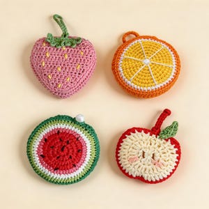 Crochet fruit charm drink carrier set, strawberry orange watermelon apple coaster style keychain, foldable mesh bag for cups, cute handmade accessory