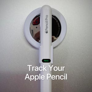 May include: White Apple Pencil Pro with a white holder and a circular device. The text "Track Your Apple Pencil" is displayed below the pencil. The word "New" is in a green box.