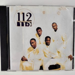 Può includere: Custodia per CD con il gruppo 112. La copertina dell'album ha uno sfondo color crema con i membri del gruppo in abiti color crema. Il nome del gruppo, "112", è in un carattere viola scuro nella parte superiore della copertina.