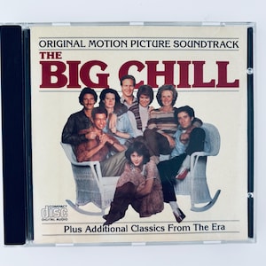 May include: A CD case featuring the soundtrack for "The Big Chill" movie. The cover art shows a group of people in a group photo. The text "Original Motion Picture Soundtrack" and "The Big Chill" are displayed in maroon and white.