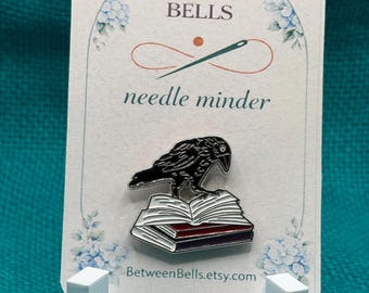 Raven on Books Needle Minder, Gothic Black Crow Enamel Needle Holder for Cross Stitch, Embroidery, Needlepoint, Dark Academia Book Lover