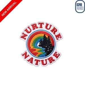 May include: Embroidered patch with the words "NURTURE NATURE" in red, arched around a rainbow and a stylized mountain scene. The patch has a white border and is labeled "NEW ARRIVAL" in red.
