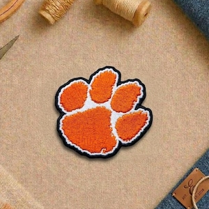 May include: A rustic wooden sign with the text "Welcome to our home" in white lettering. The sign features a distressed finish and a simple, inviting design, perfect for a front porch or entryway.