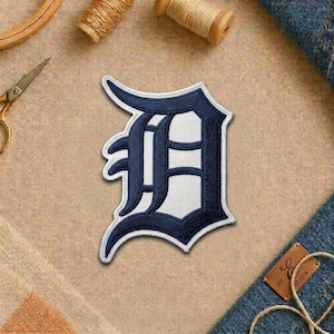 May include: A set of three ceramic mugs with a speckled, matte finish. The mugs are in shades of cream, light gray, and dark gray. Each mug has a simple, minimalist design, perfect for coffee or tea.