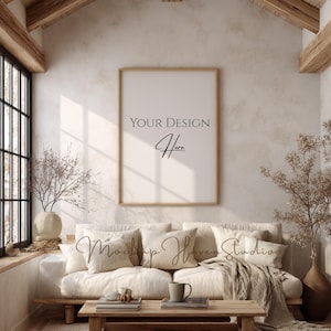 May include: A cozy living room scene with a light-colored sofa, pillows, and a wooden coffee table. A framed print with the text "YOUR DESIGN Here" hangs on the wall. The room features natural light, a rug, and decorative vases.