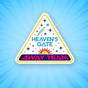 May include: A triangular patch featuring a white background with a yellow border. The text HEAVEN'S GATE appears in blue above a red sun graphic. Below, the text AWAY TEAM is in pink on a dark blue bar. The design includes blue stars and a comet.