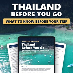 May include: A digital tablet displaying a travel guide titled Thailand Before You Go, featuring the subtitle The practical essentials for your first trip, checked for late 2026, with printed pages showing entry and paperwork details visible behind it.